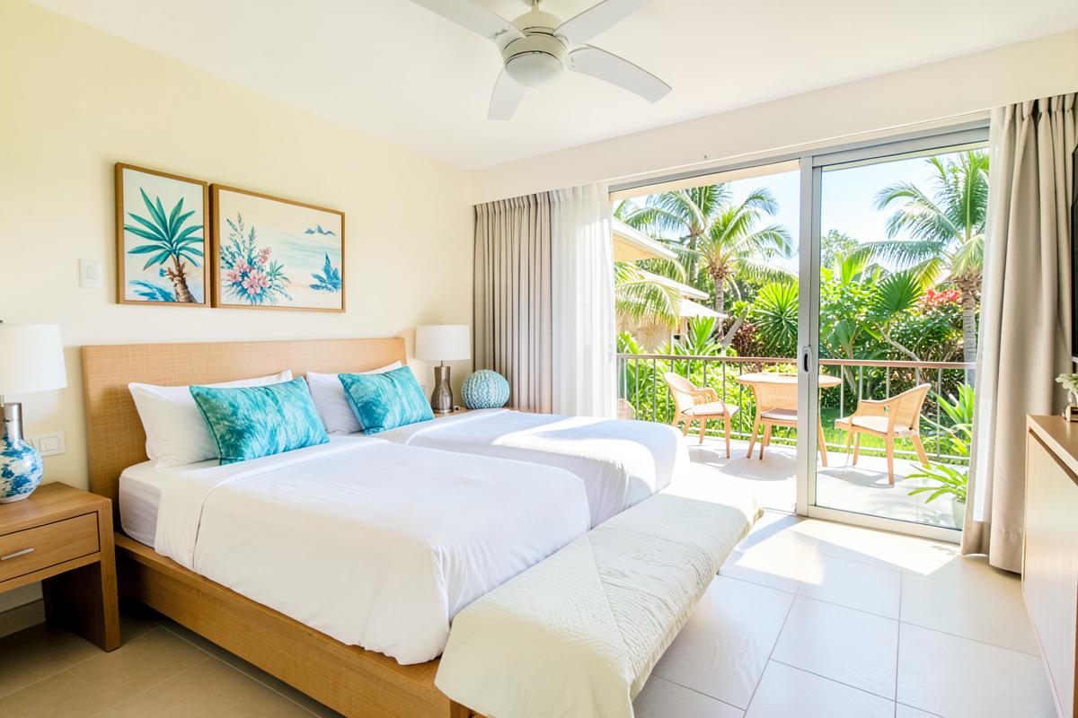 Superior room with two queen beds and a balcony overlooking gardens